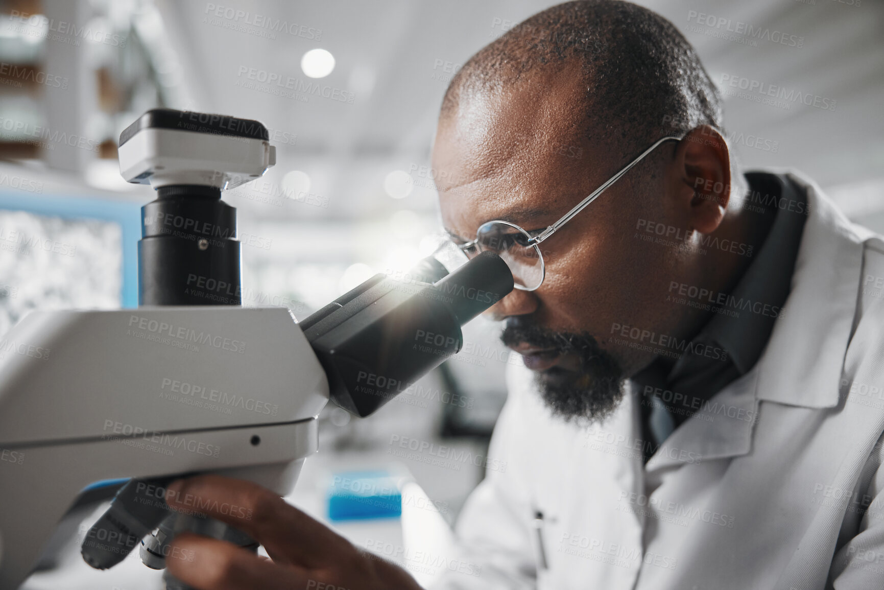 Buy stock photo Black man, medical science and microscope in laboratory for analysis, innovation and results or research. Development, glasses and professional scientist in hospital for wellness, cure or health care