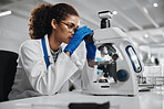 Microscope, woman and virus research of science study with healthcare, scientist and laboratory work. Analysis, testing and medical professional with disease investigation for scientific journal