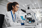 Science, woman and research with microscope in lab for investigation, development and bacteria test. Scientist, innovation and biotech with planning for stem cell study, exam or growth in vaccinology