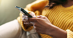 Hands, connection and phone in home for scroll, typing and text message on couch in living room. Female person, network and mobile app for creating profile, chat and explore on dating website on sofa