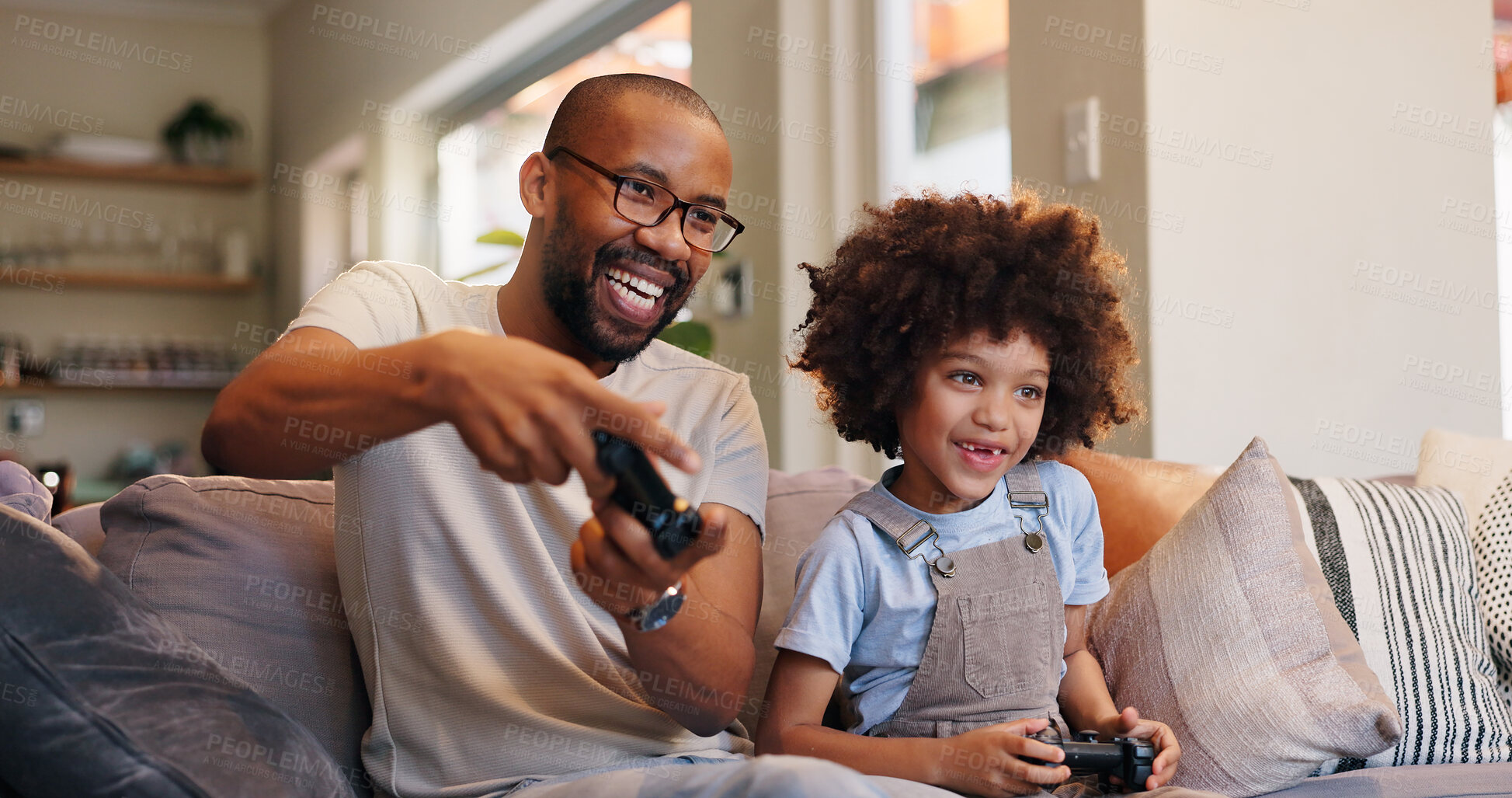 Buy stock photo Happy dad, sofa and video games with son for fun entertainment or bonding together at home. Father, child or little boy enjoying esports or co op gameplay with controller on console or couch at house