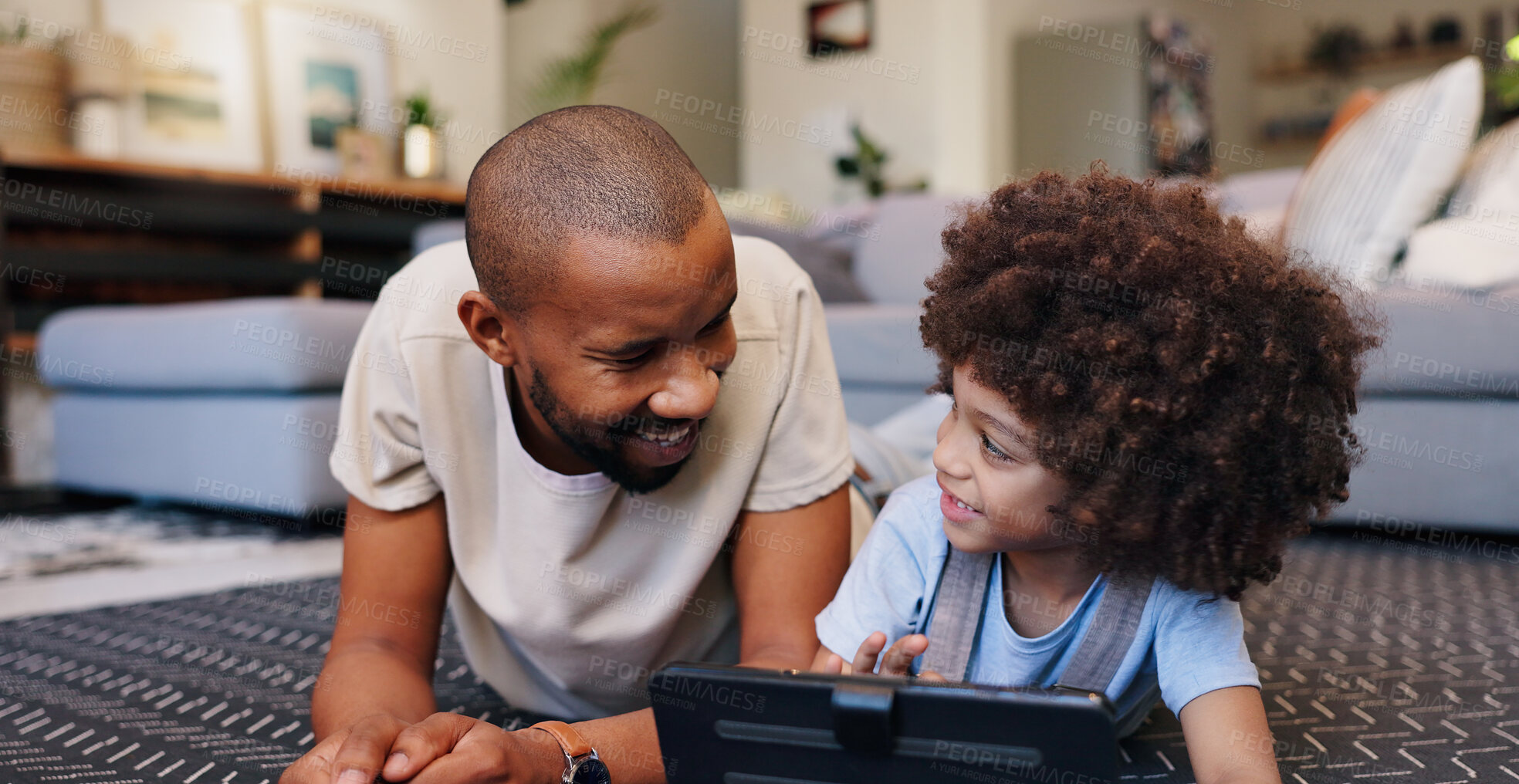 Buy stock photo Education, gaming or tablet with father and son on floor of living room in home for child development. Distance learning, family or streaming tech with single parent man and boy kid in apartment