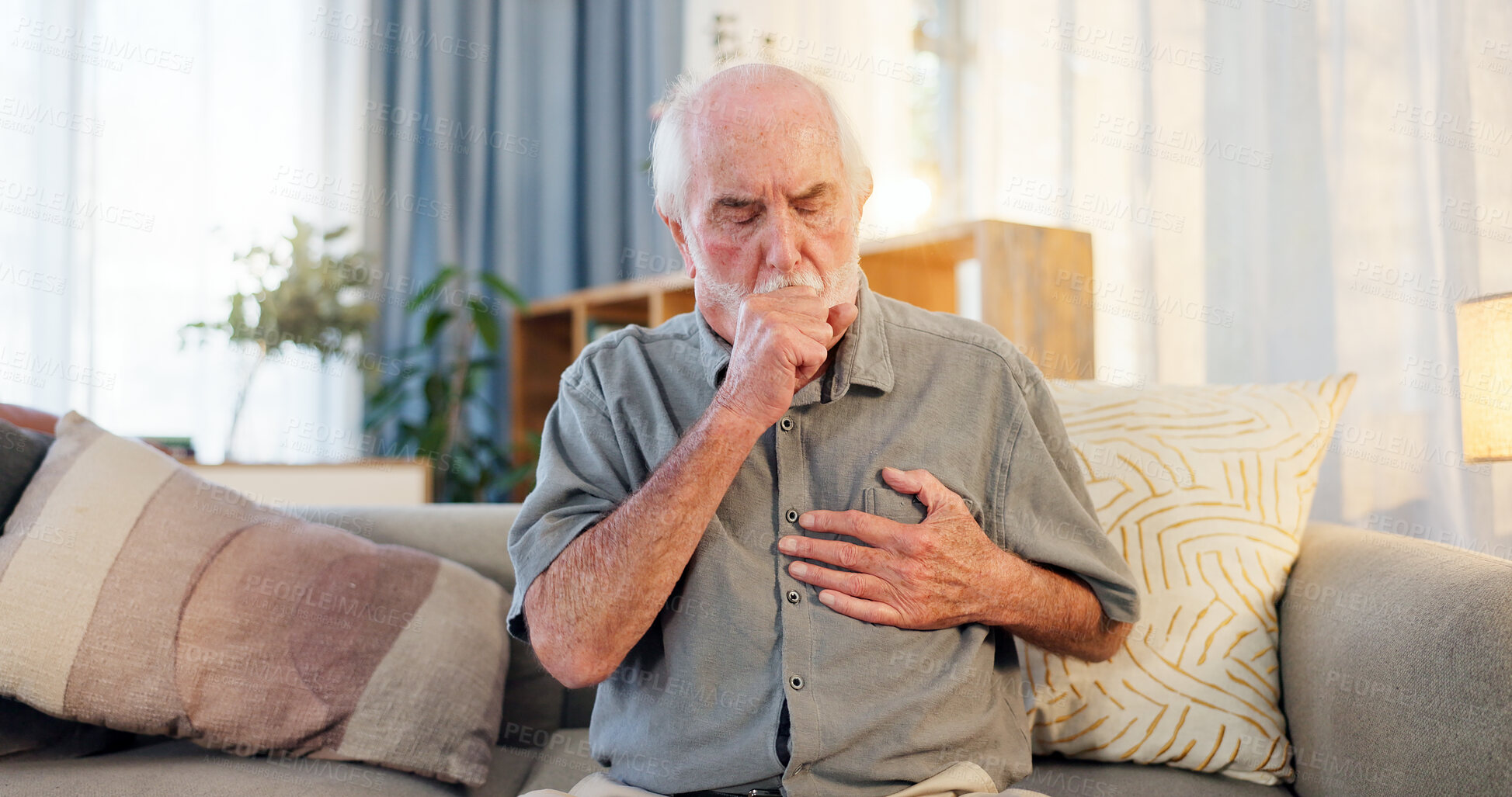 Buy stock photo Sick, cough and senior man on couch with allergies, flu or cold in retirement home with emergency. Illness, chest pain and elderly person with asthma, infection and lung problem with COVID 19 virus