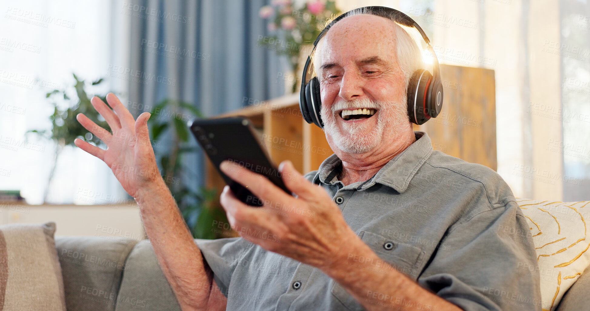 Buy stock photo Phone, headphones and senior man dancing for music with retirement, jazz playlist and relax on home sofa. Elderly person, mobile and listening to radio for entertainment, online audio or happy dance