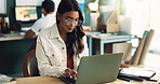 Research, glasses and woman with laptop in office for project plan, brainstorming and information. Creative, person and web design with tech at desk for digital portfolio, update and ux development