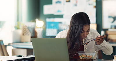 Buy stock photo Girl, eating and food in home office with laptop for online, remote work and lunch break for hunger or multitasking. Female freelancer, internet and noodles with salad for heathy diet and brunch.