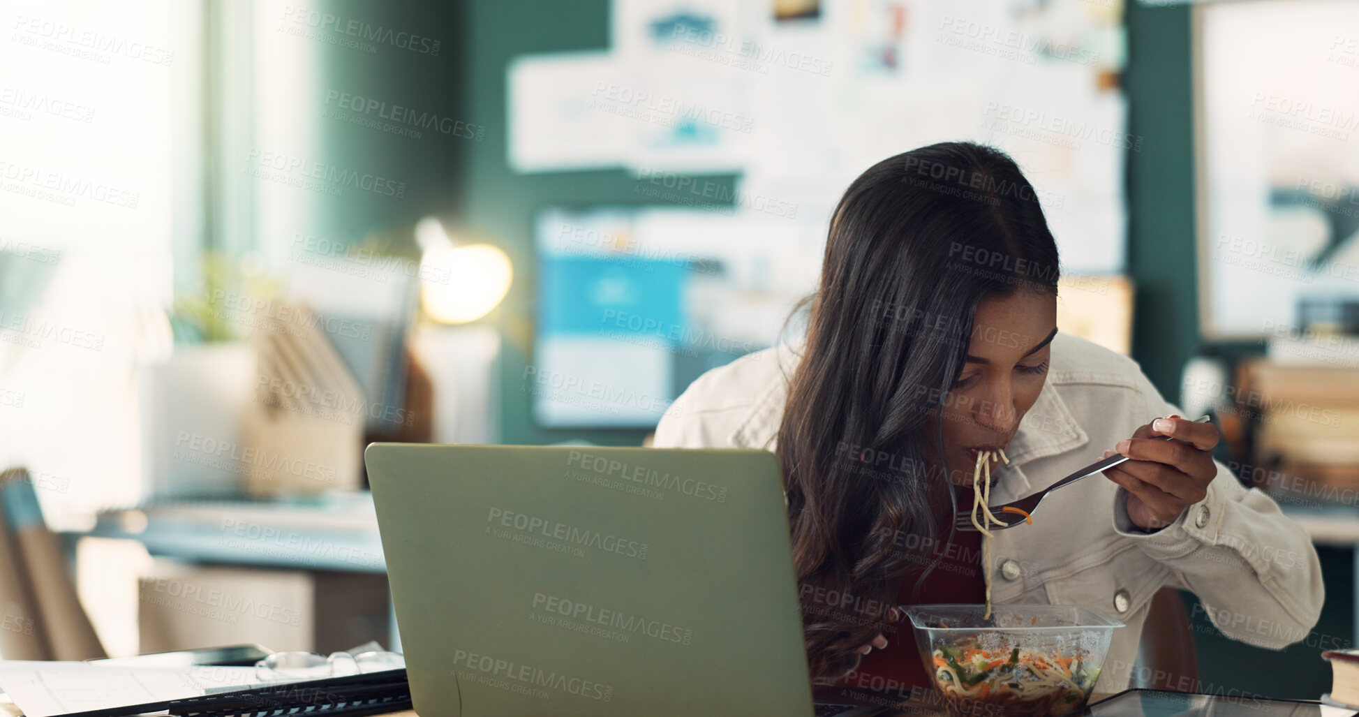 Buy stock photo Girl, eating and food in home office with laptop for online, remote work and lunch break for hunger or multitasking. Female freelancer, internet and noodles with salad for heathy diet and brunch.