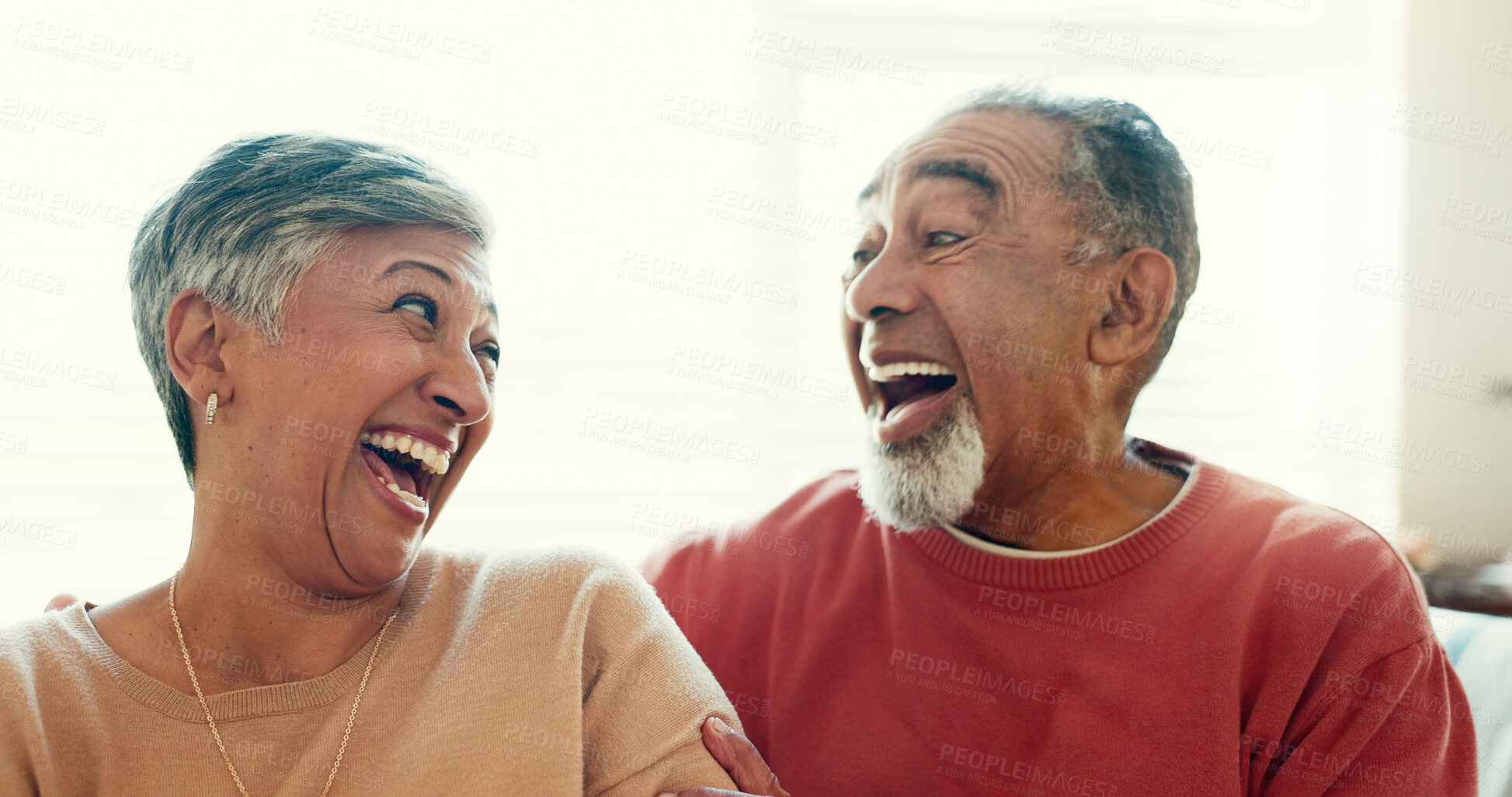 Buy stock photo Mature couple, laughing and happy home for retirement with love, care and support with bonding. People, relationship and smile as pensioner for marriage with fun, jokes and relax on break as soulmate