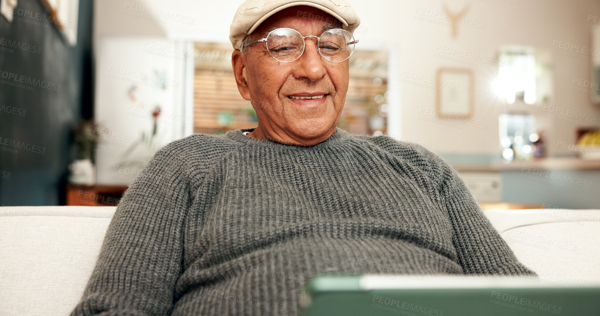 Buy stock photo Senior man, tablet and sofa for social media and scrolling, technology and home for relax in living room. Streaming, video and network for connection, retirement and online gambling poker in lounge