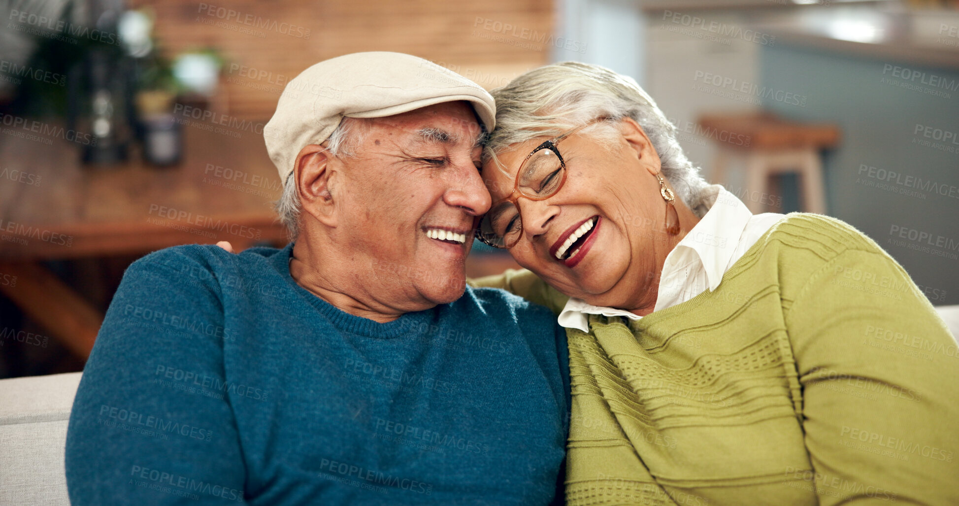 Buy stock photo Happy, elderly couple and hug with love on sofa for bonding, support and embrace for relationship memory. Smile, woman and man with trust, care and relax together on couch of retirement peace at home