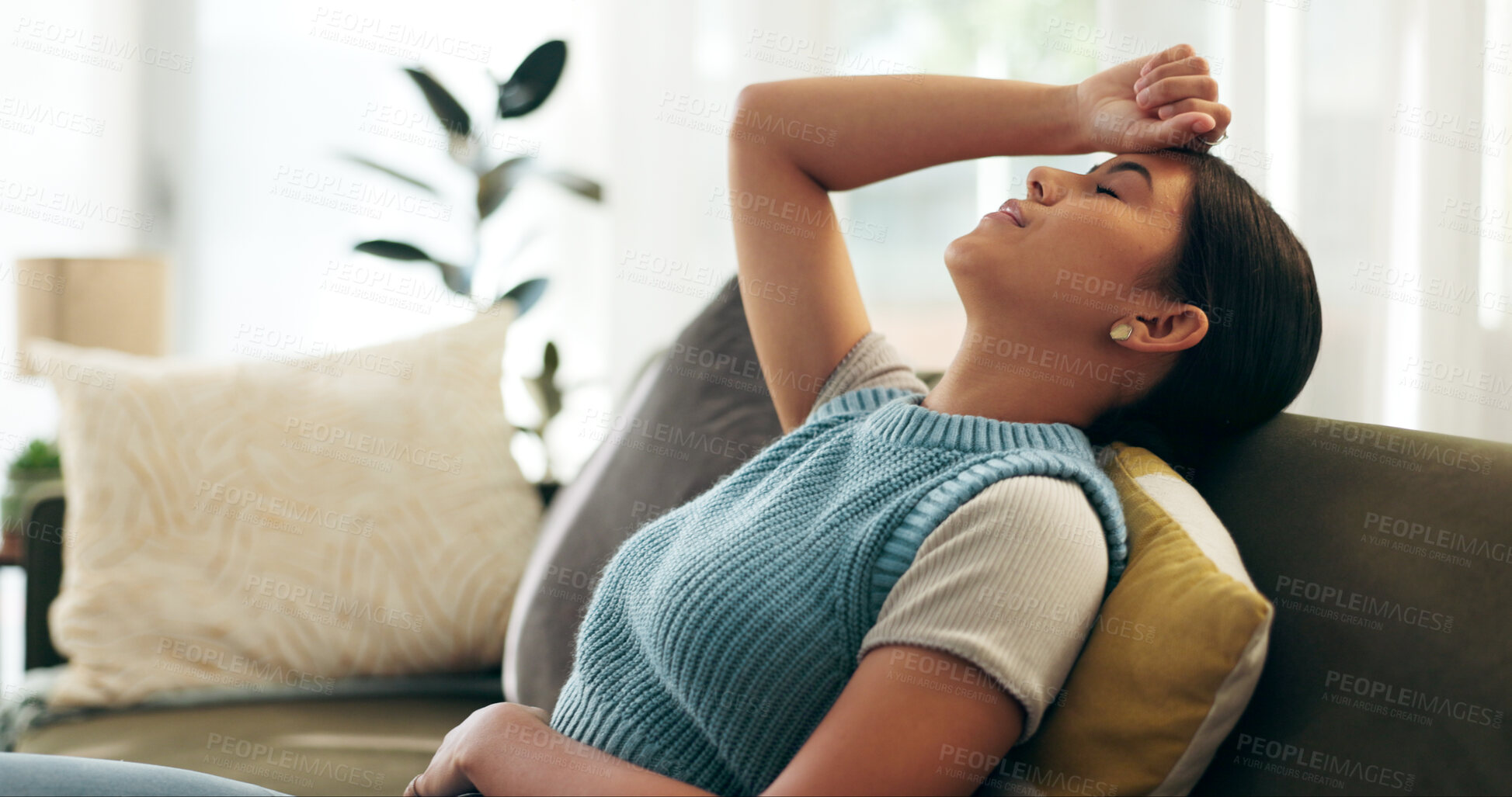 Buy stock photo Woman, headache and stress on couch for morning in home with pain and fatigue on weekend. Female person, stretching and rest on sofa in living room for anxiety and self care in apartment or condo