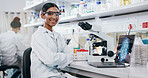 Portrait, scientist and happy woman on microscope with arms crossed in lab for chemistry research. Laptop, science and confident face of medical doctor in goggles for microbiology, health or study