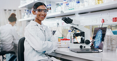 Buy stock photo Portrait, scientist and happy woman on microscope with arms crossed in lab for chemistry research. Laptop, science and confident face of medical doctor in goggles for microbiology, health or study