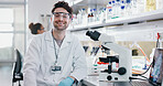 Portrait, scientist and happy man on microscope in lab for chemistry research, test or innovation. Laptop, science or confident face of medical doctor in goggles for microbiology, healthcare or study