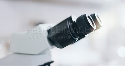 Buy stock photo Closeup, science and microscope in lab for research, experiment or innovation. Microbiology, tools and zoom on equipment with lens for health study, chemistry or medical development of biotechnology