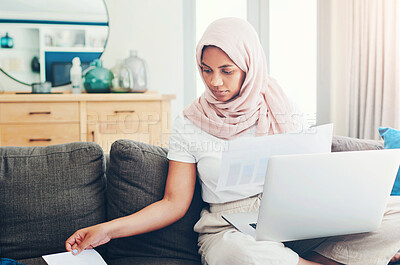 Buy stock photo Muslim woman, laptop and paperwork for remote work on couch, email and freelancer on website in home. Female person, accountant and planning on internet, hijab and research on finance or networking