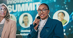 Portrait, happy woman and speaker at convention as event host, guest or panel at summit. Face, presenter and person with mic for conference speech on innovation in renewable energy, tech and science