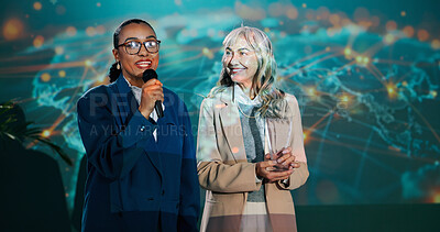 Buy stock photo Women, mic and speech at conference for presentation, public speaking and international convention. Presenter, networking and seminar on stage for audience, motivation or global event with tech pitch
