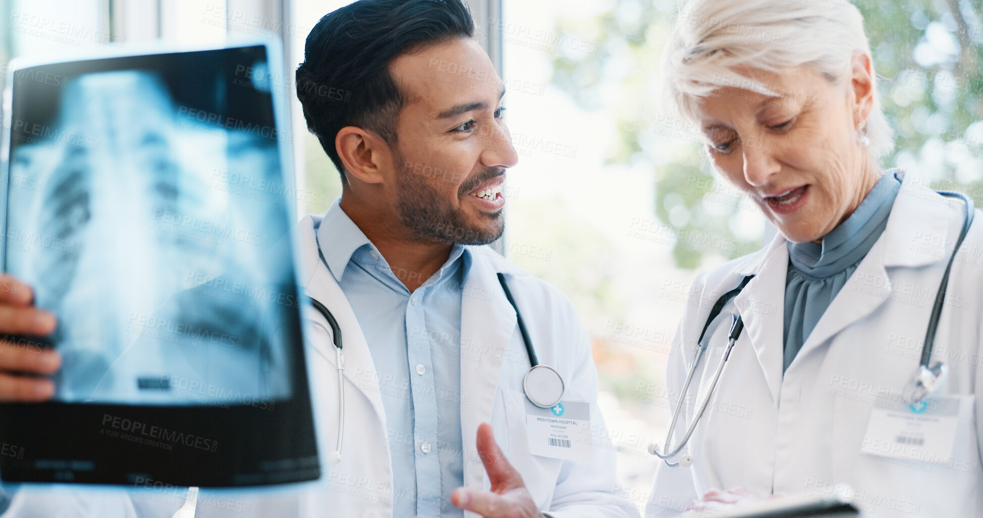 Buy stock photo Doctors, x ray and medical discussion in hospital, professional and collaboration for patient chest results. Mature radiologist, tablet and researching or diagnosis, people and wellness consultation