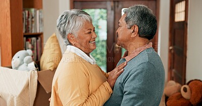 Buy stock photo Love, moving and senior couple in home with hugging for happiness with new property for retirement. Smile, bonding and elderly man and woman embracing for new house with cardboard box together.