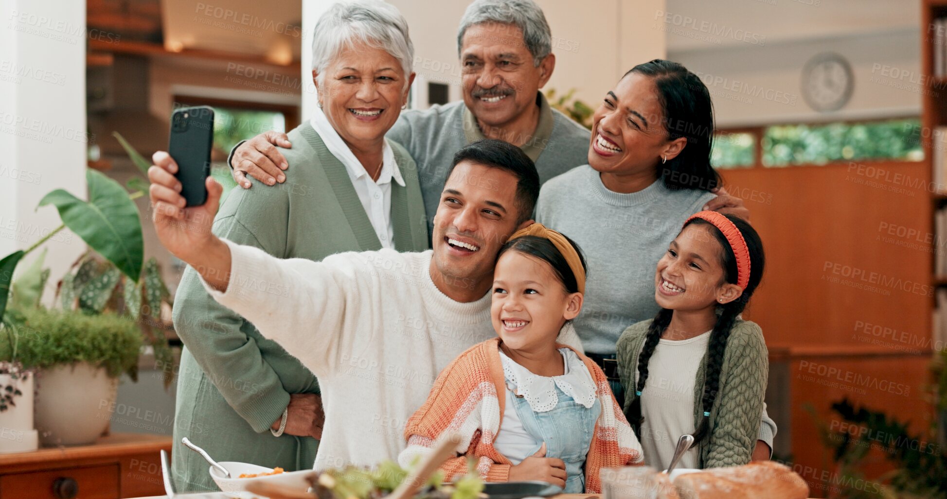 Buy stock photo Family, home and happy with selfie for lunch in table for memories, profile picture and social media. People, grandparents and kids with bonding for love, support and care with thanksgiving gathering