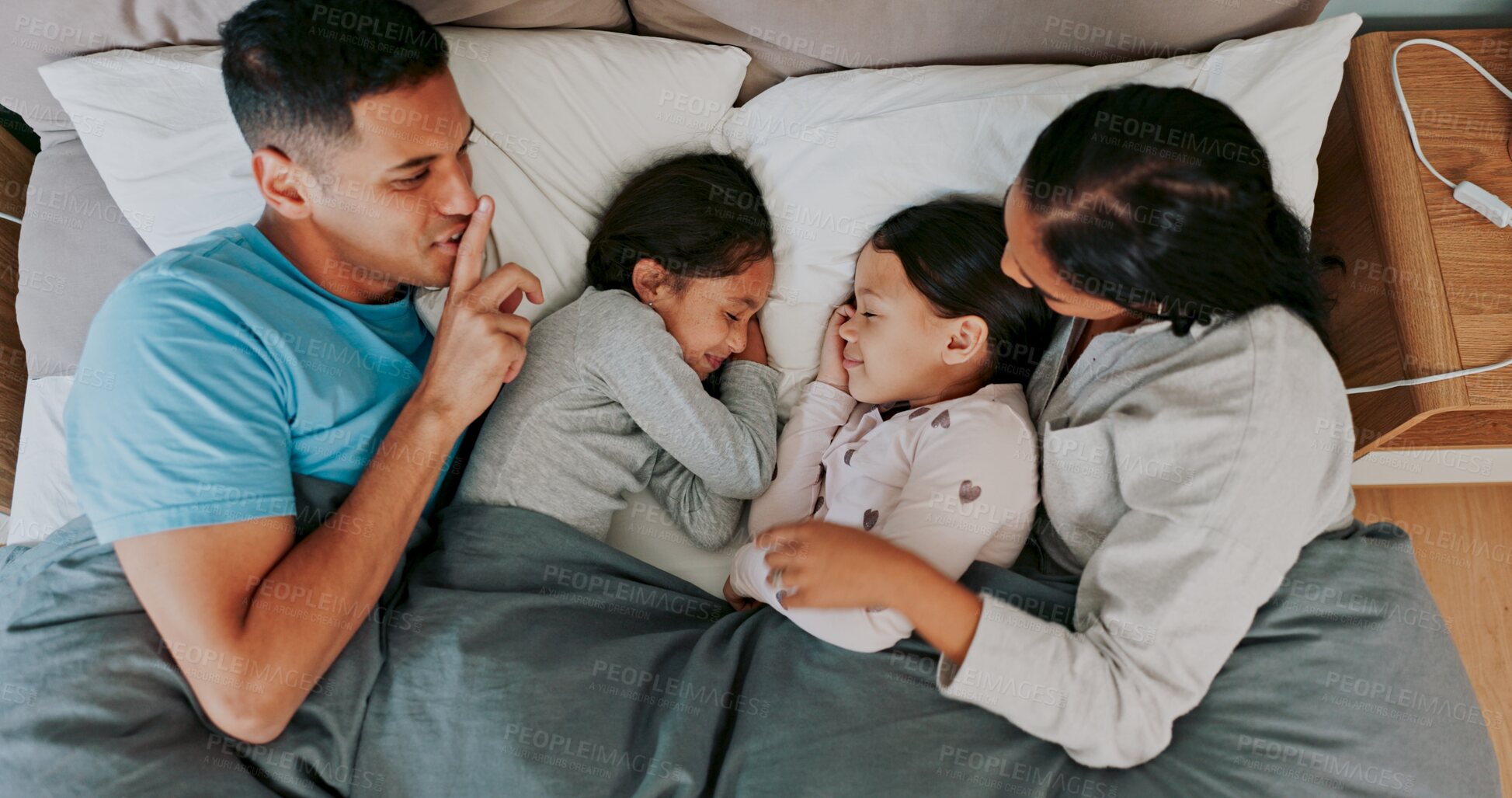 Buy stock photo Morning, parents and children sleeping in bed for tired, rest or dreaming in bedroom, Top view, family man and happy woman with girl kids in home for bonding, embrace or quiet gesture on weekend