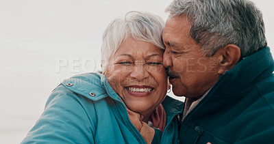 Buy stock photo Kiss, love and elderly couple on beach together for holiday bonding, retirement or vacation. Anniversary, romance or smile with senior man and woman on tropical island coast for peace or travel