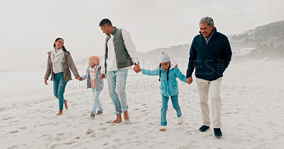 Buy stock photo Family, girl and holding hands on beach for travel, development and adventure for bonding. Kid, parents and playful with walking, care and love in happiness, fun and together on weekend or holiday