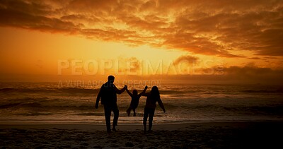 Buy stock photo Family, silhouette and holding hands at beach with sunset while walking in summer for relax and travel. Parents, child and back with support, freedom or trust outdoor for bonding, love and vacation