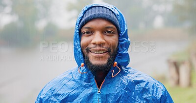 Buy stock photo Black man, portrait and rain for travel outdoor on camping adventure, explore and nature journey in morning. African, male person and smile for hiking, freedom and trekking woods for winter vacation