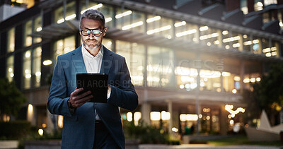 Buy stock photo Mature businessman, tablet and building at night for office innovation, research and company regulations in city. Male boss, smile and tech in evening for info, update and report for accounting firm