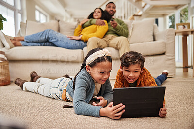 Buy stock photo Family, kids and happy on floor with tablet at home for online games, streaming platform and entertainment. Parent, siblings and fun in living room with bonding for child development and growth