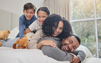 Buy stock photo Love, family and happy with support on bed for bonding, fun game or relax with wake up in morning. Parents, smile or children on back in bedroom with care, trust or relationship with playing in house