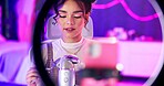 ASMR, relax and influencer woman with microphone, ring light and audio content creator in neon home studio. Streamer, girl and recording video for sound art platform, live stream or online broadcast