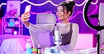 Selfie, influencer and girl with live streaming update in neon bedroom with social media audience, fans or followers. Excited content creator, gamer or streamer by mic, smartphone and gaming at home