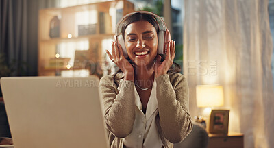 Buy stock photo Headphones, Indian woman and night with laptop, music and home with audio and remote work. Freelancer, streaming and smile with happy, relax and tech in a living room and listening to pop song