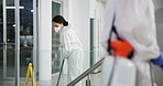 Woman, cleaner and mopping for hygiene, fresh and disinfectant for virus protection or housekeeping. People, worker and ppe suit for bacteria, disease and prevention in office as janitor for company