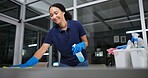 Cleaner, cleaning table woman in office for fumigation, spray disinfect and safety suit from disease risk in building. Maintenance, person and chemical liquid for pest control, health and hygiene