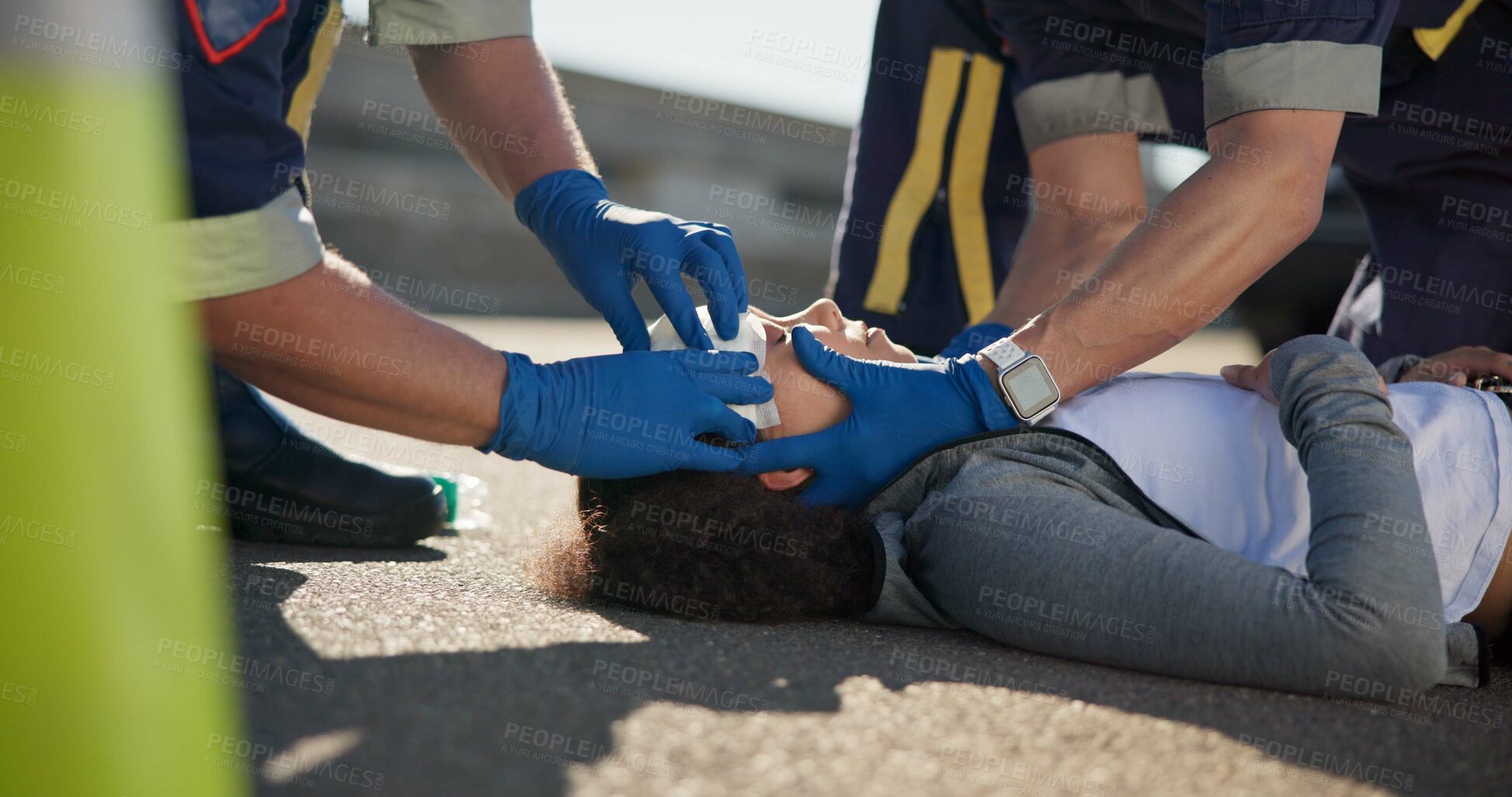 Buy stock photo Paramedic, accident and hands on head injury on road in car crash emergency with healthcare people. EMS, wrapping bandage or first responder with victim or rescue in street for transport to hospital