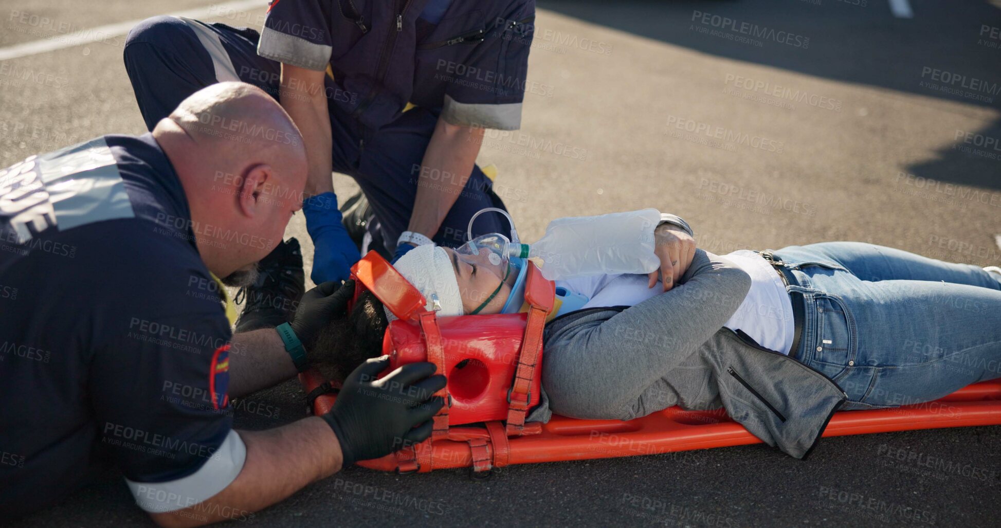 Buy stock photo Outdoor, emergency and patient with paramedics, healthcare and rescue with accident. People, medical and professional with victim, teamwork and injury on street, service and ambulance with first aid