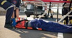 Person, accident and emergency on street with stretcher for life support, medical response to trauma with oxygen. Safety, first aid or health insurance or air mask for breath on road, ems or crisis