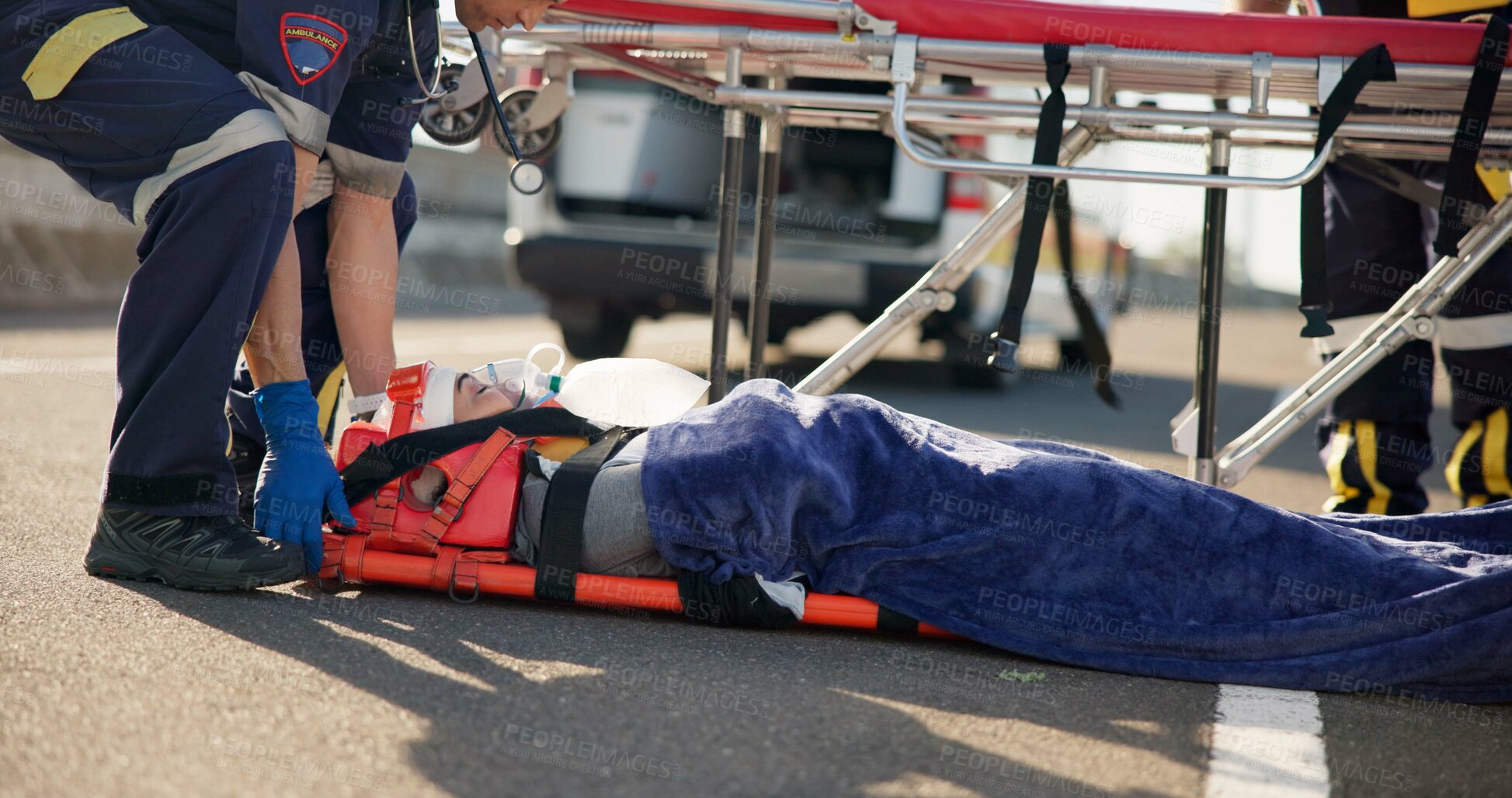 Buy stock photo Person, accident and emergency on street with stretcher for support, medical response to trauma with oxygen. Safety, first aid or health insurance or air mask for breath on road, ems or crisis