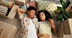 Couple, above and resting on new home floor, mortgage and love for relationship or moving with boxes. People, property investment and together in apartment living room, care and homeowners sleeping
