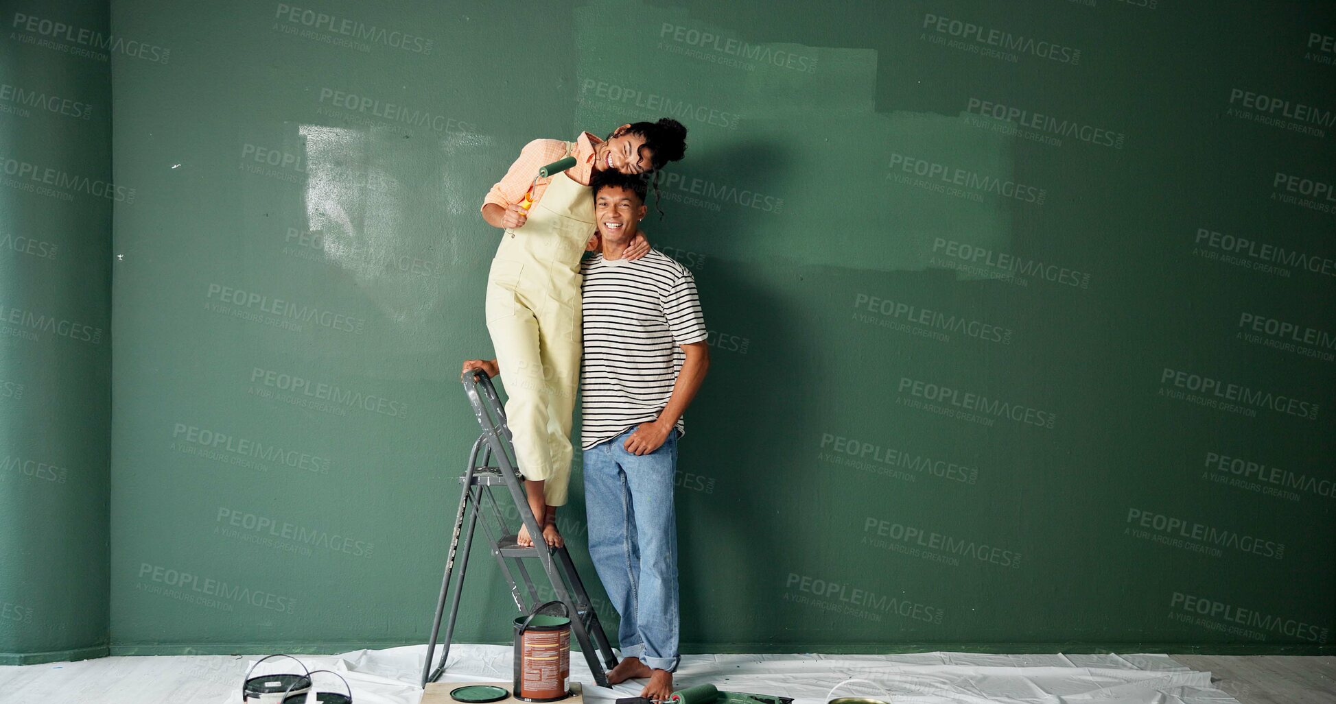 Buy stock photo Couple, people and happy with painting wall for house renovations, upgrade and bonding. New home, relationship and smile for makeover for fun with support, care and teamwork for love with space