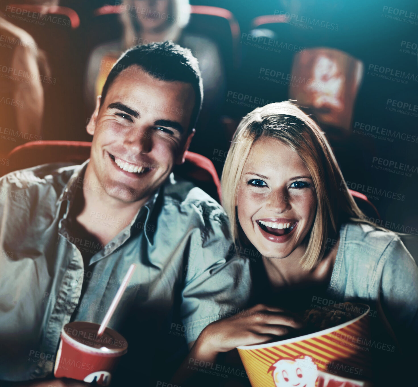 Buy stock photo Cinema, comedy and portrait of couple with popcorn, watching film or eating on romantic date together. Movie night, man and woman in theater with snacks, laughing and sitting in auditorium to relax
