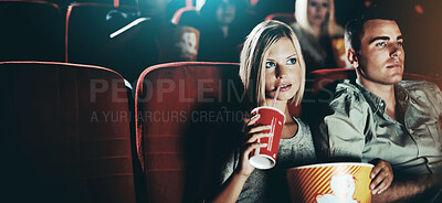 Buy stock photo Seat, popcorn and a couple in the cinema watching a movie for entertainment while on a date. Love, food or romance and young people in a theater audience to experience a film together with a drink