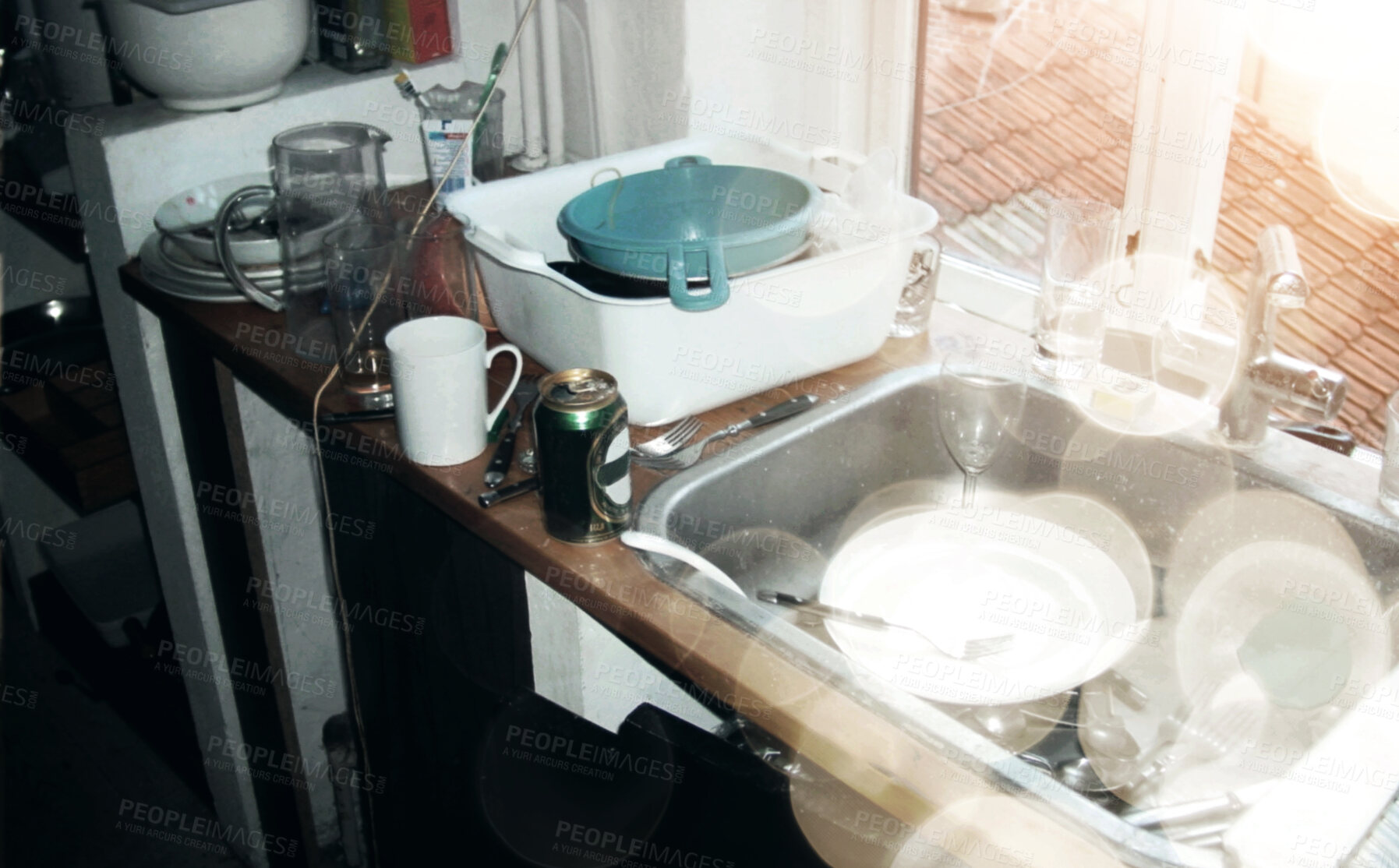 Buy stock photo Above messy and untidy kitchen sink with dirty dishes and empty beer bottles after a party. Start cleaning, glasses and cutlery in and around a sink in a filthy kitchen the morning after a fun night