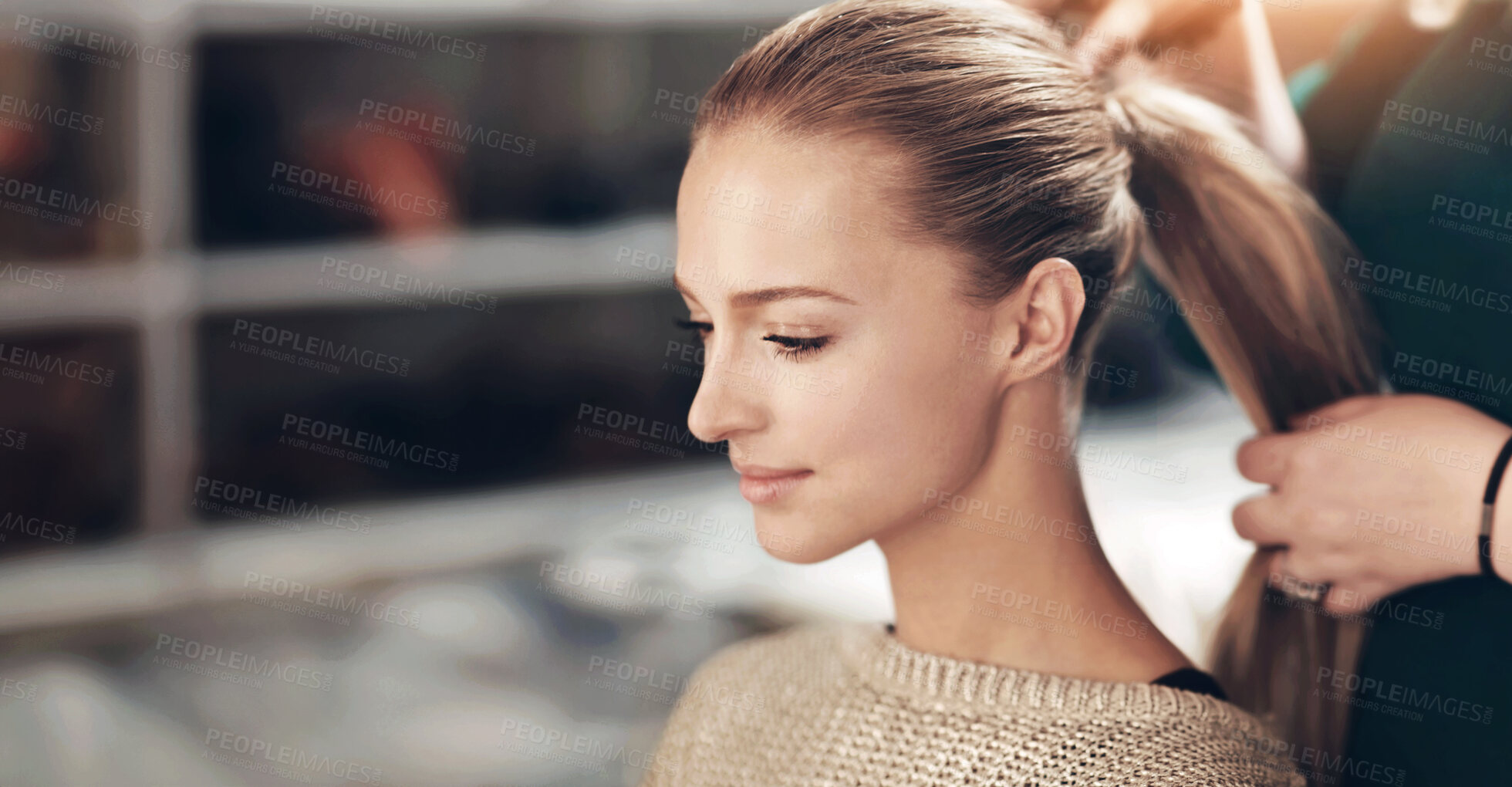 Buy stock photo A young woman getting her hair done