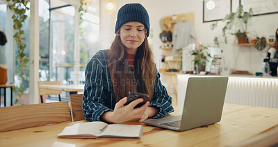 Buy stock photo Woman, phone and laptop in coffee shop for remote work with notification, check and reading with freelance job. Person, smartphone and thinking with contact, networking and mobile app in cafeteria