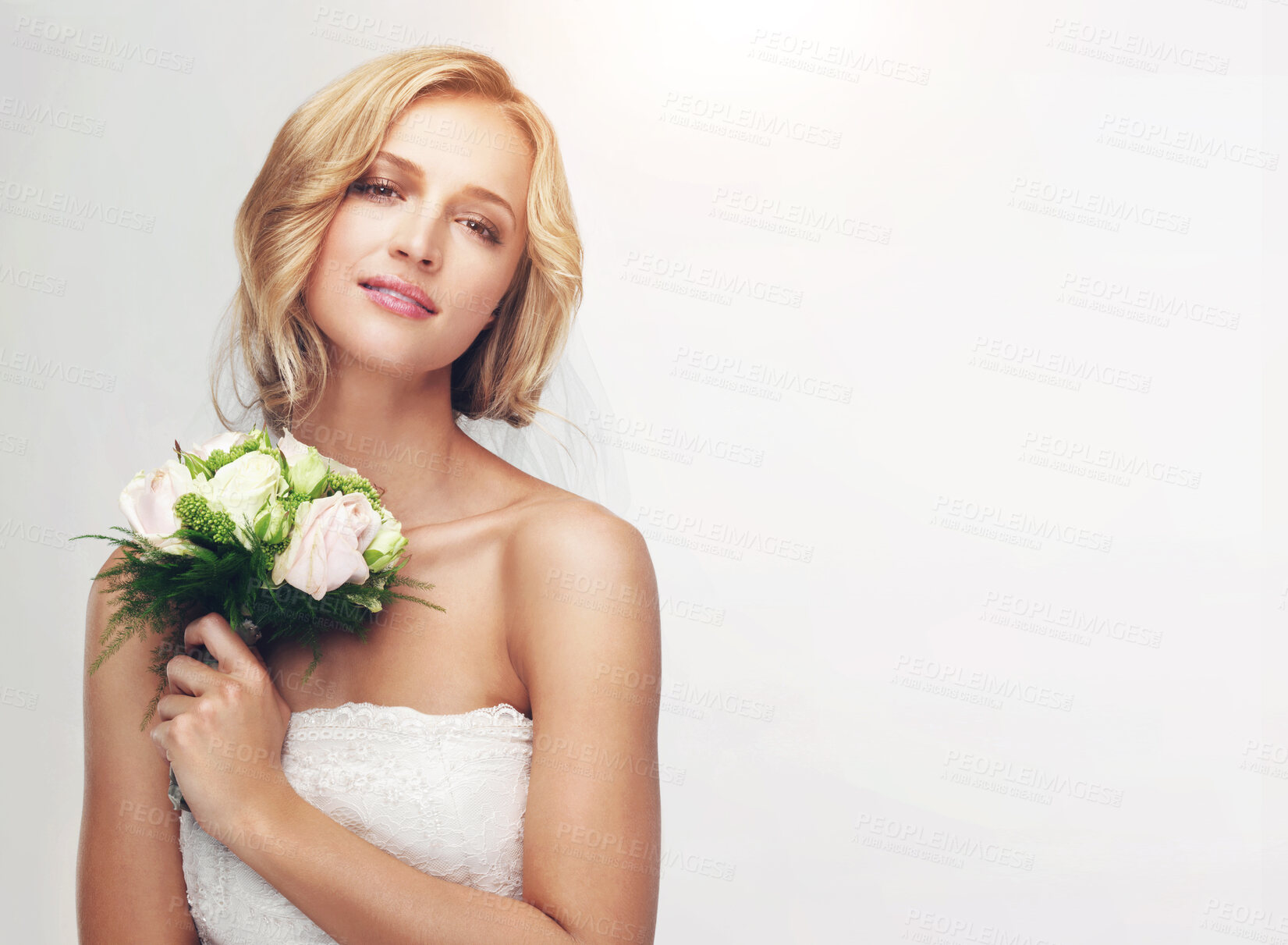 Buy stock photo Marriage, wedding and woman or bride in a studio with a bouquet on a white background. Portrait face of a young model with rose flowers, beauty makeup and wedding dress fashion design with mockup